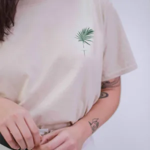 woman in white and green floral crew neck t-shirt